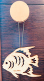 Wood ornament in the shape of a tropical angel fish. With "Key West".