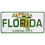 License Plate factory picture showing a Florida style license plate with the State picture in the background partly covered by an orange, and the writting "FLORIDA" (big green letters in the middle as well as smaller capital orange letters on top) and green letters "SUNSHINE STATE" at the bottom.