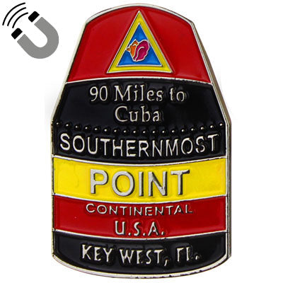 Metal magnet in the shape and design of the Southernmost Point with at the top, a triangular design showing a conch shell (red background), then underneath "90 Miles to Cuba" and "SOUTHERNMOST" with a black background, then underneath "POINT" with a yellow background, then underneath "CONTINENTAL U.S.A." with a red background and finally at the bottom "KEY WEST, FL" with a black background.