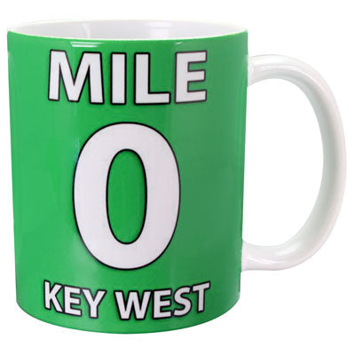 Picture of the mug showing "MILE 0 KEY WEST" on a dark green background wrapping the mug with a white handle.