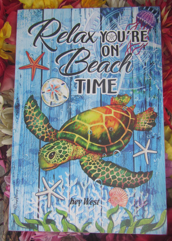 Wall Art showing a beautiful sea turtle, sea shells, sea star, sand dollar, "Relax You're on Beach Time" and "Key West".