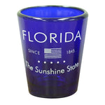 Blue glass shot glass showing the USA flag, "Florida", "Since 1845" and "The Sunshine State".