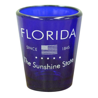 Blue glass shot glass showing the USA flag, "Florida", "Since 1845" and "The Sunshine State".