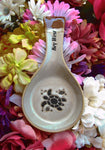 Natural color spoon rest showing a sea turtle, a tiny fish and a seashell, with "Key West" on the handle.